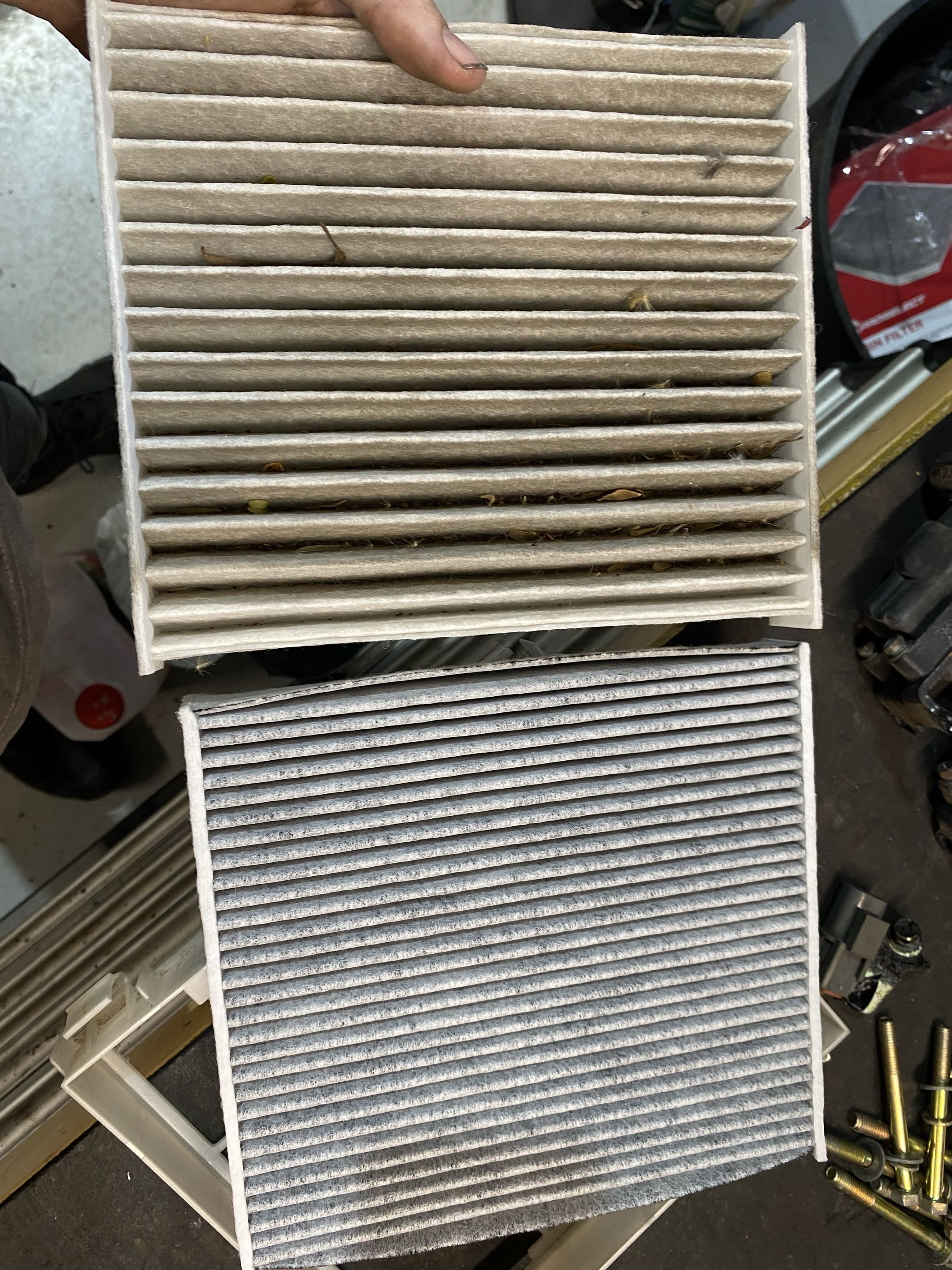Dirty cabin filter removed during vehicle servicing